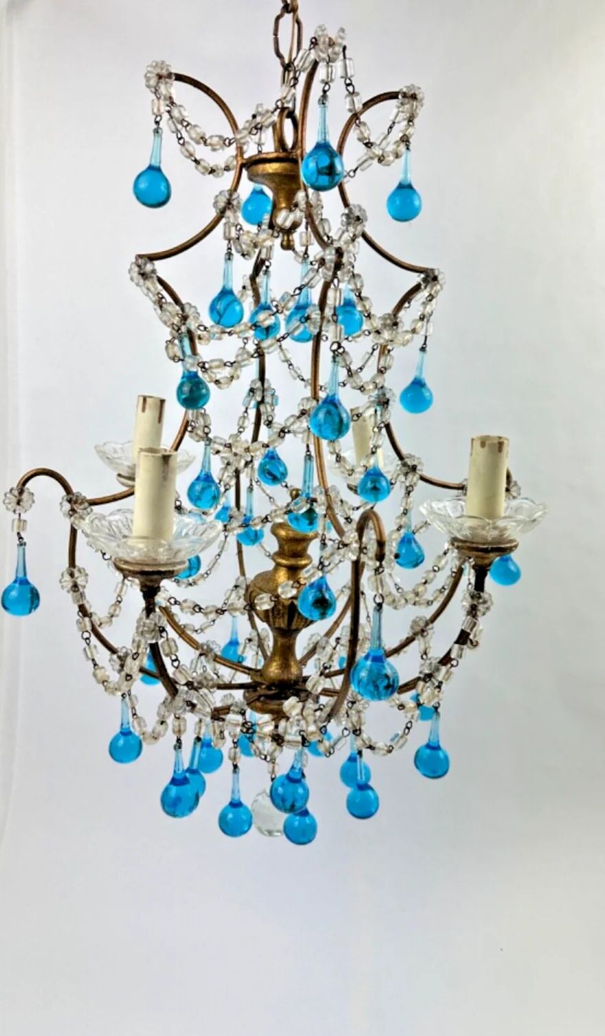 Italian chandelier with blue beads and gilded wood.