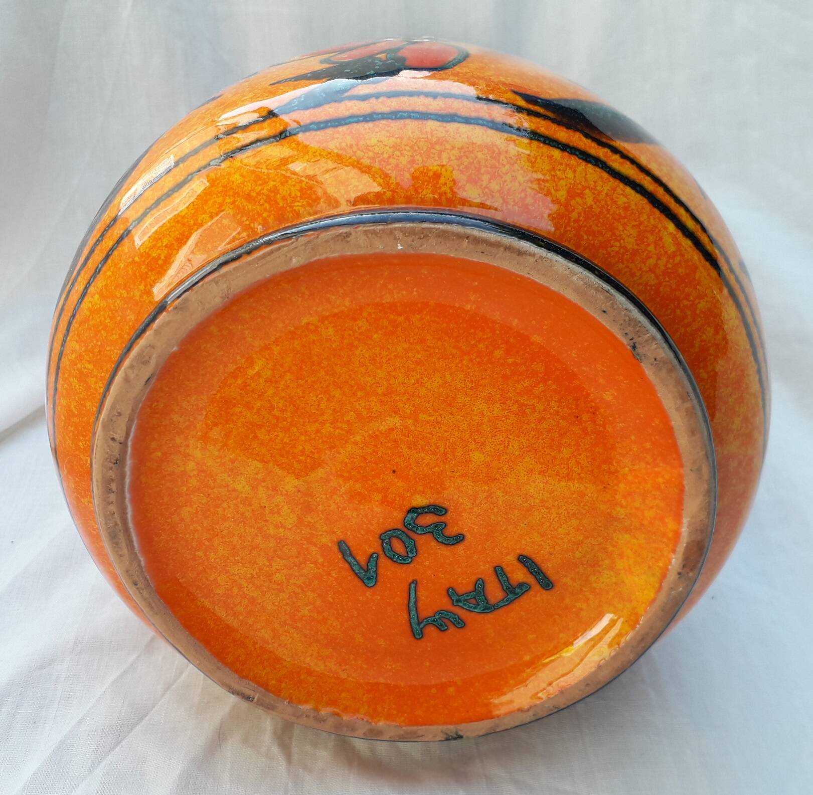 Orange ceramic jug