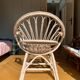 Shell chair in pale pink painted rattan