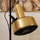 Black floor lamp is gold vintage 1980