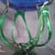 Bowl, centerpiece on twisted blue and green glass legs