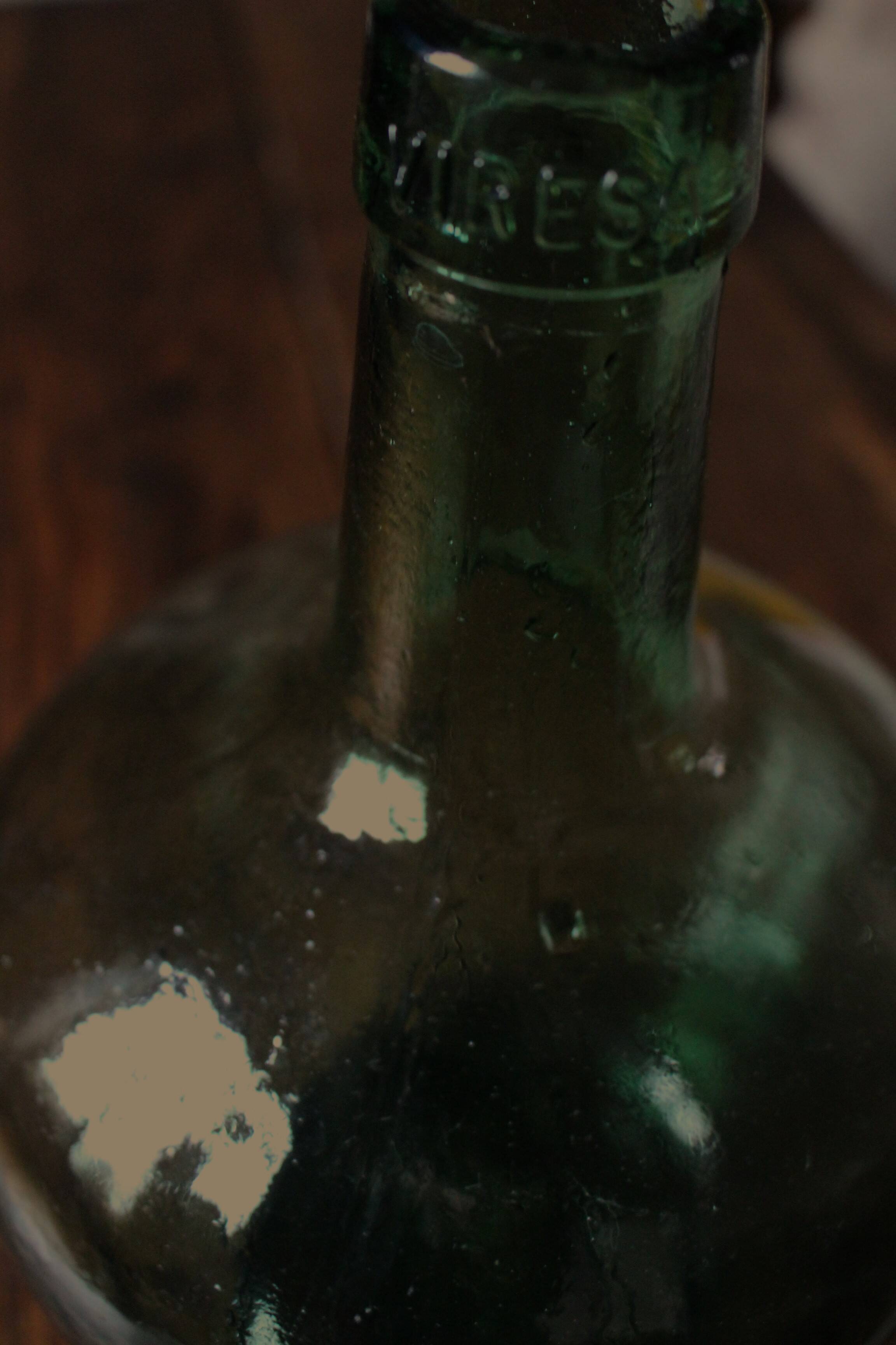 Dame Jeanne carboy from the Viresa Collection in green glass