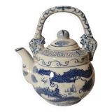 Old Chinese blue and white teapot in vintage ceramic with dragon decor