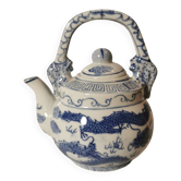 Old Chinese blue and white teapot in vintage ceramic with dragon decor