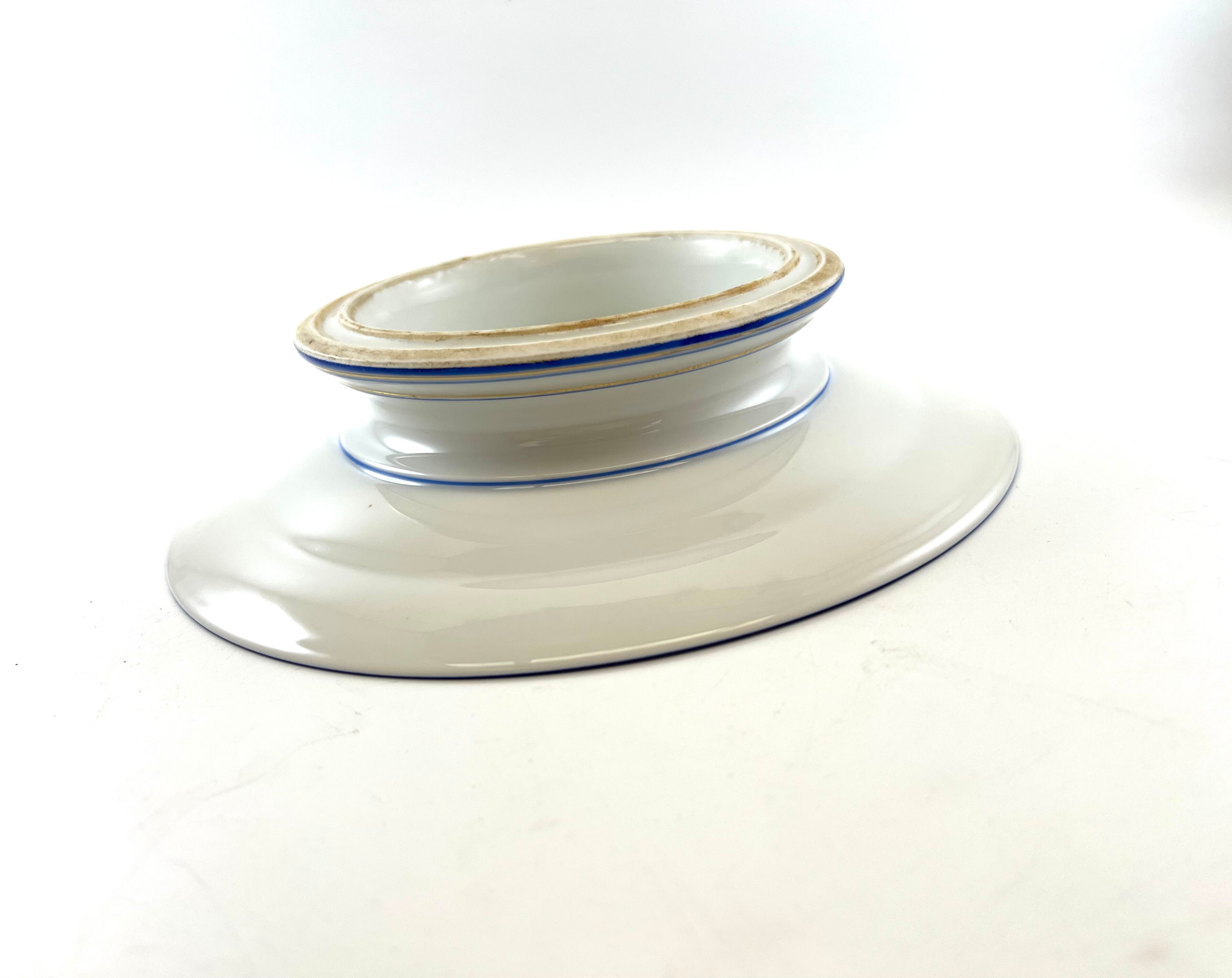 Compotier or flat cut with monogrammed white biscuit cake