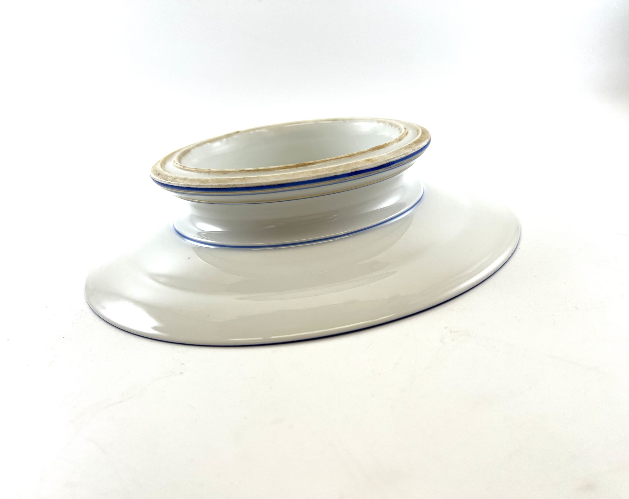 Compotier or flat cut with monogrammed white biscuit cake