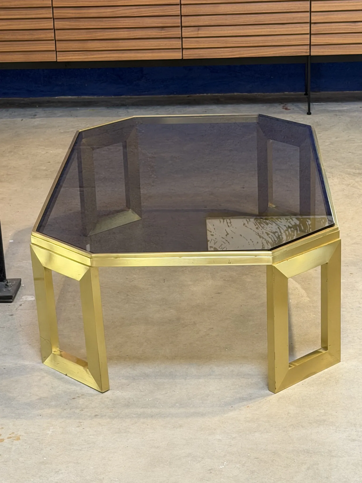 Octagonal brass coffee table, signed Anna Nora.