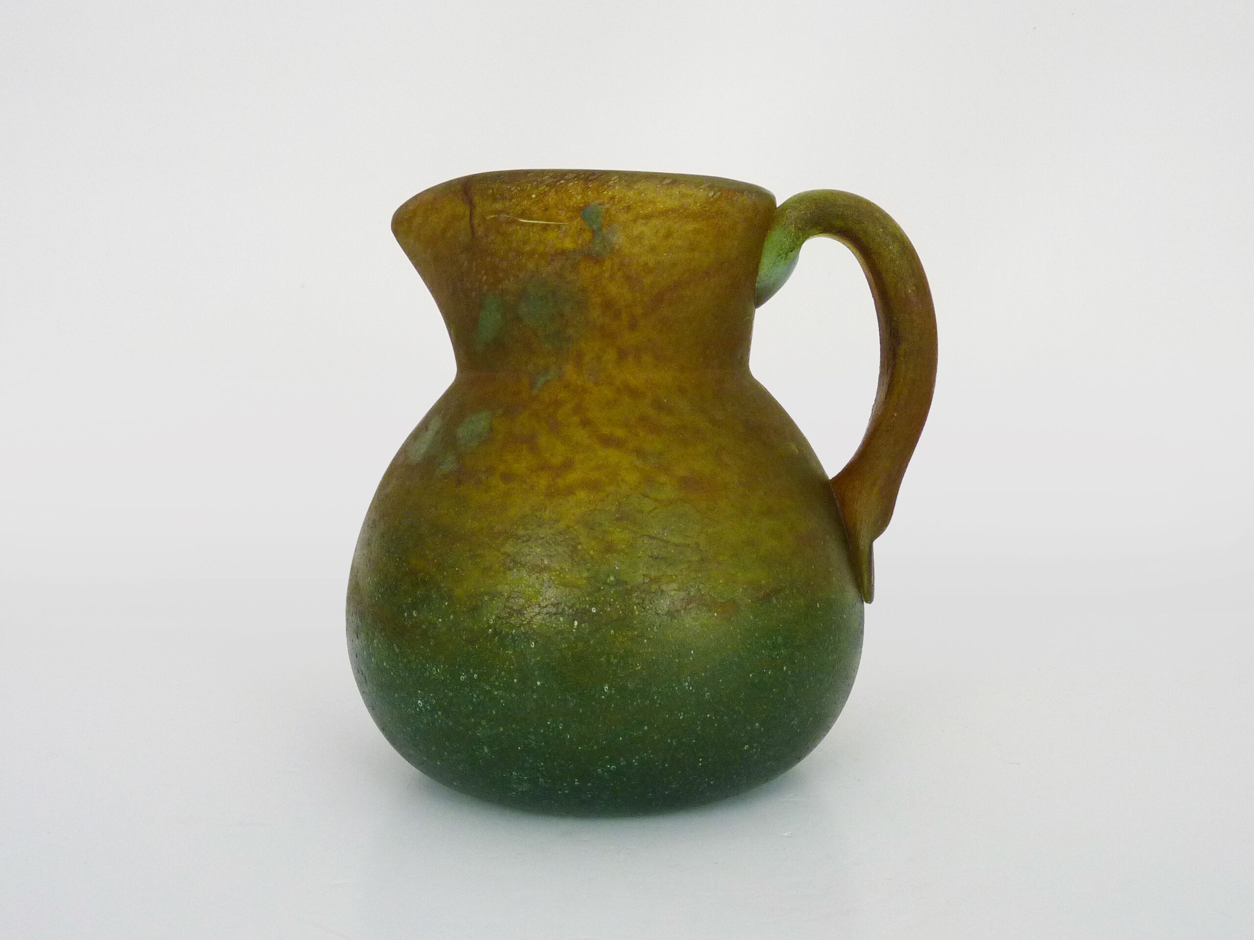 Pitcher in orange and green marble glass paste. Signed Georges De Feure for Daum