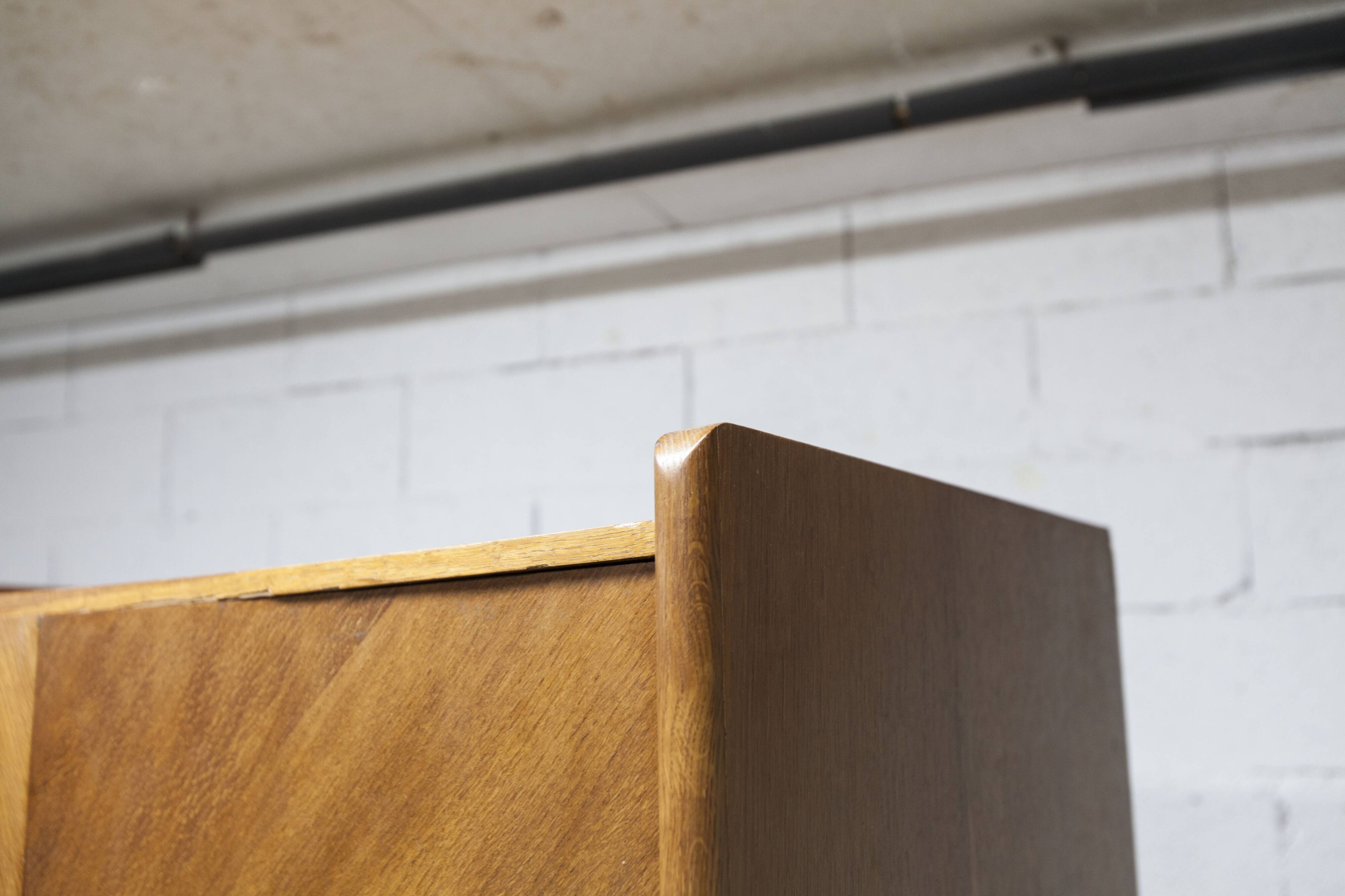 1950s Mid-Century Modern oak armoire with two doors and two drawers.