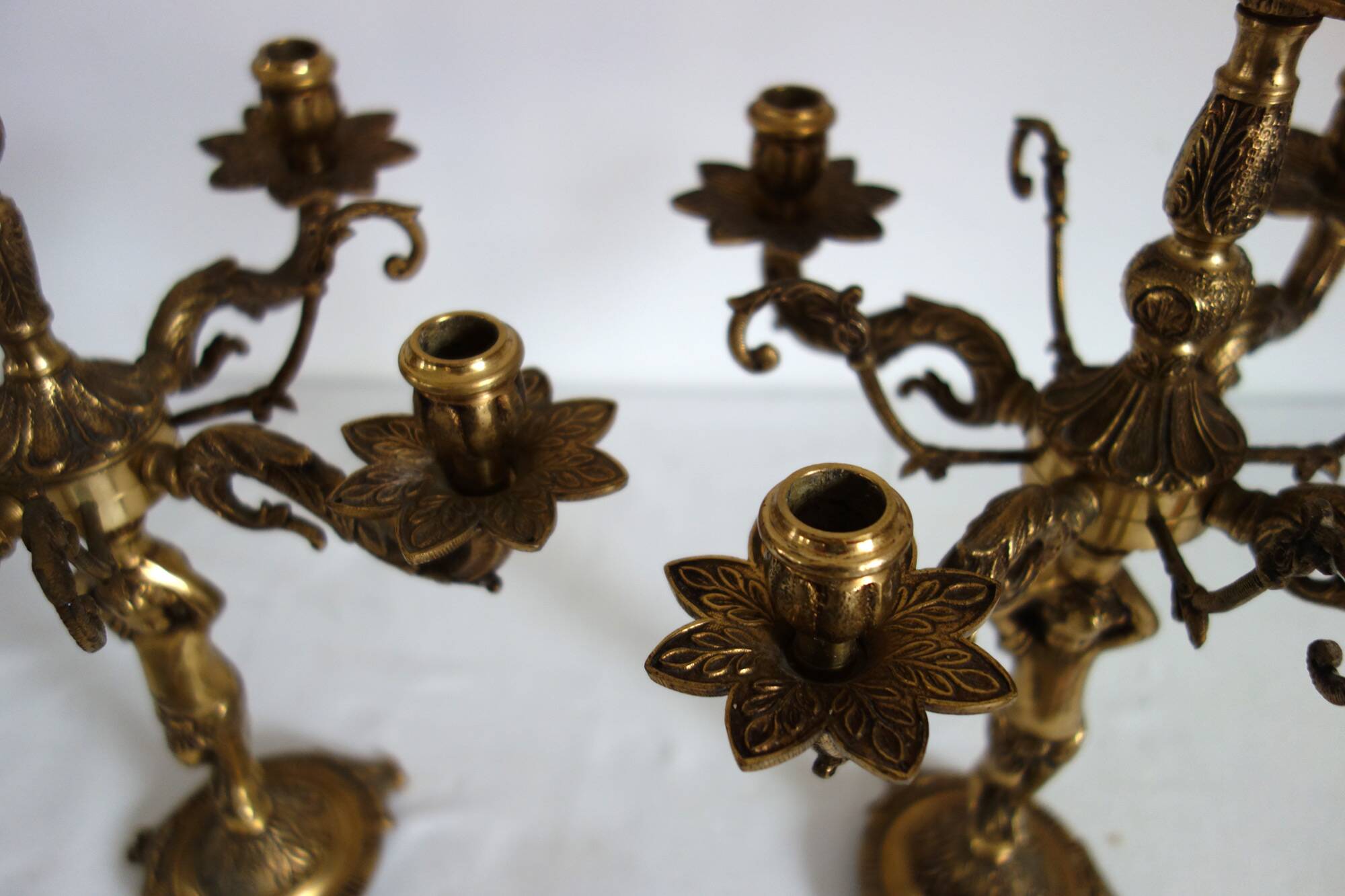 Pair of cherub candlesticks in gilded bronze early 20th century
