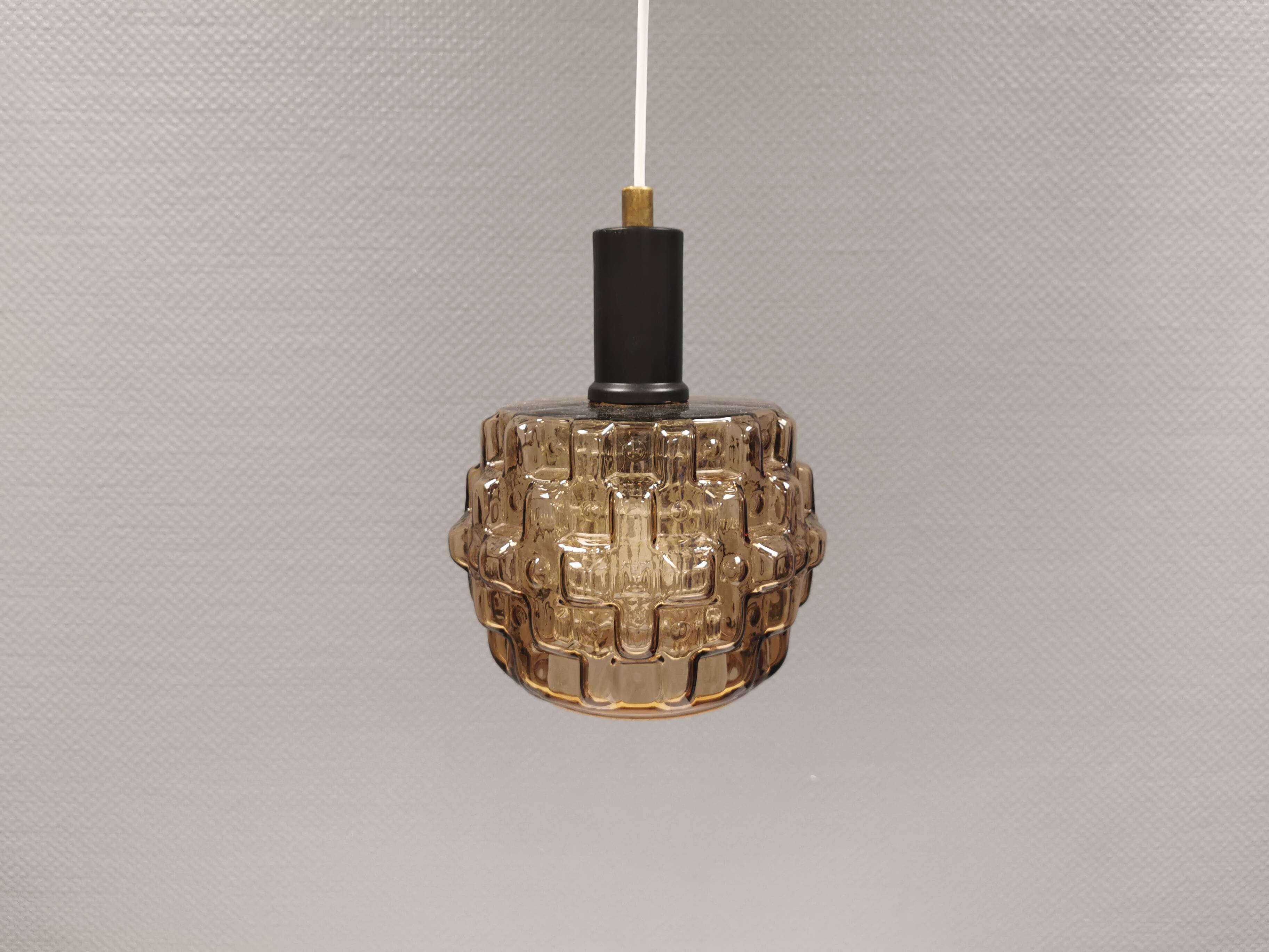 Older hanging lamp with champagne colored outer glass with inner shade of crystal glass.