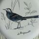 Flat plate in faience of gien the wagtail old signature