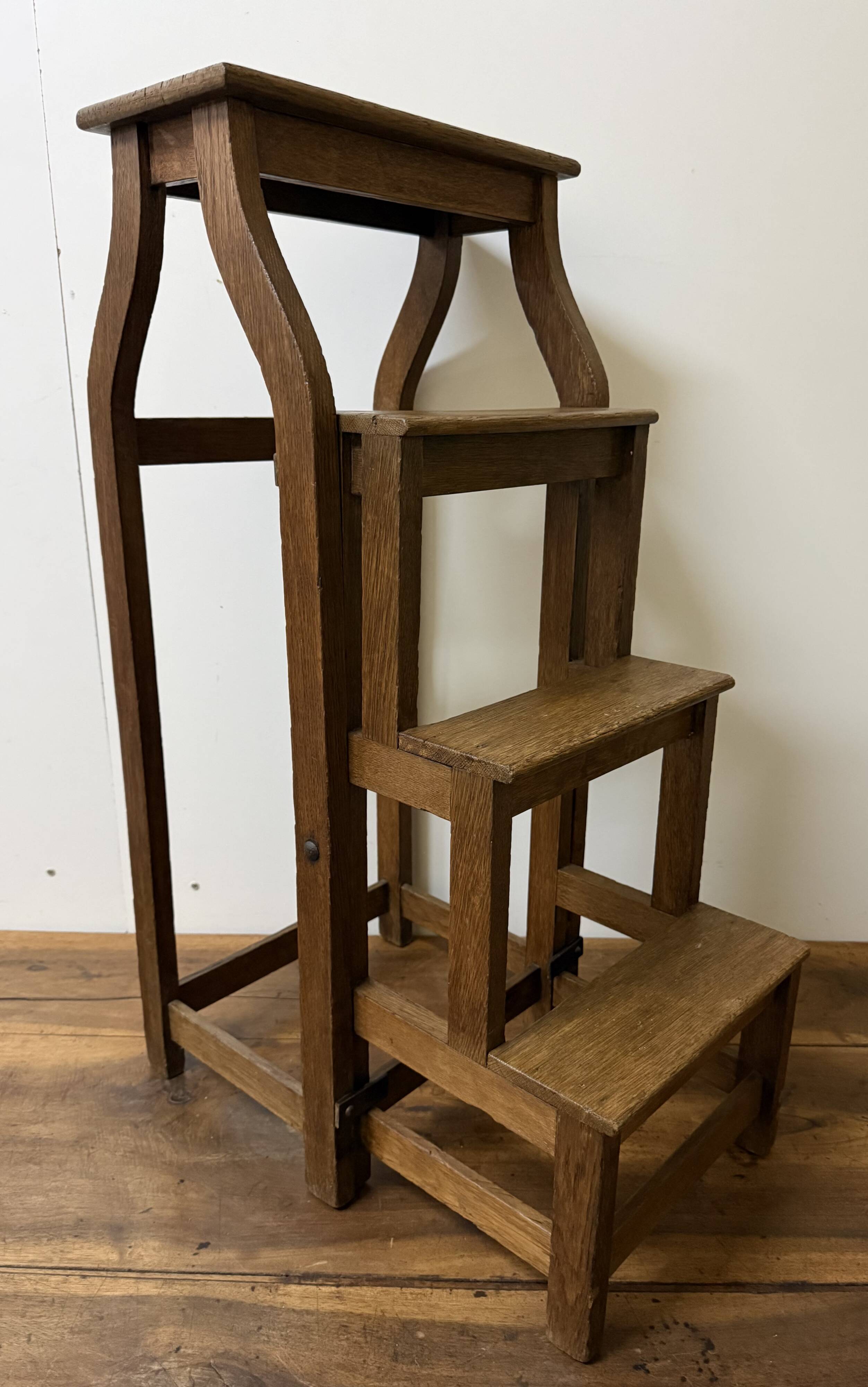 Stool transforming into a step ladder.