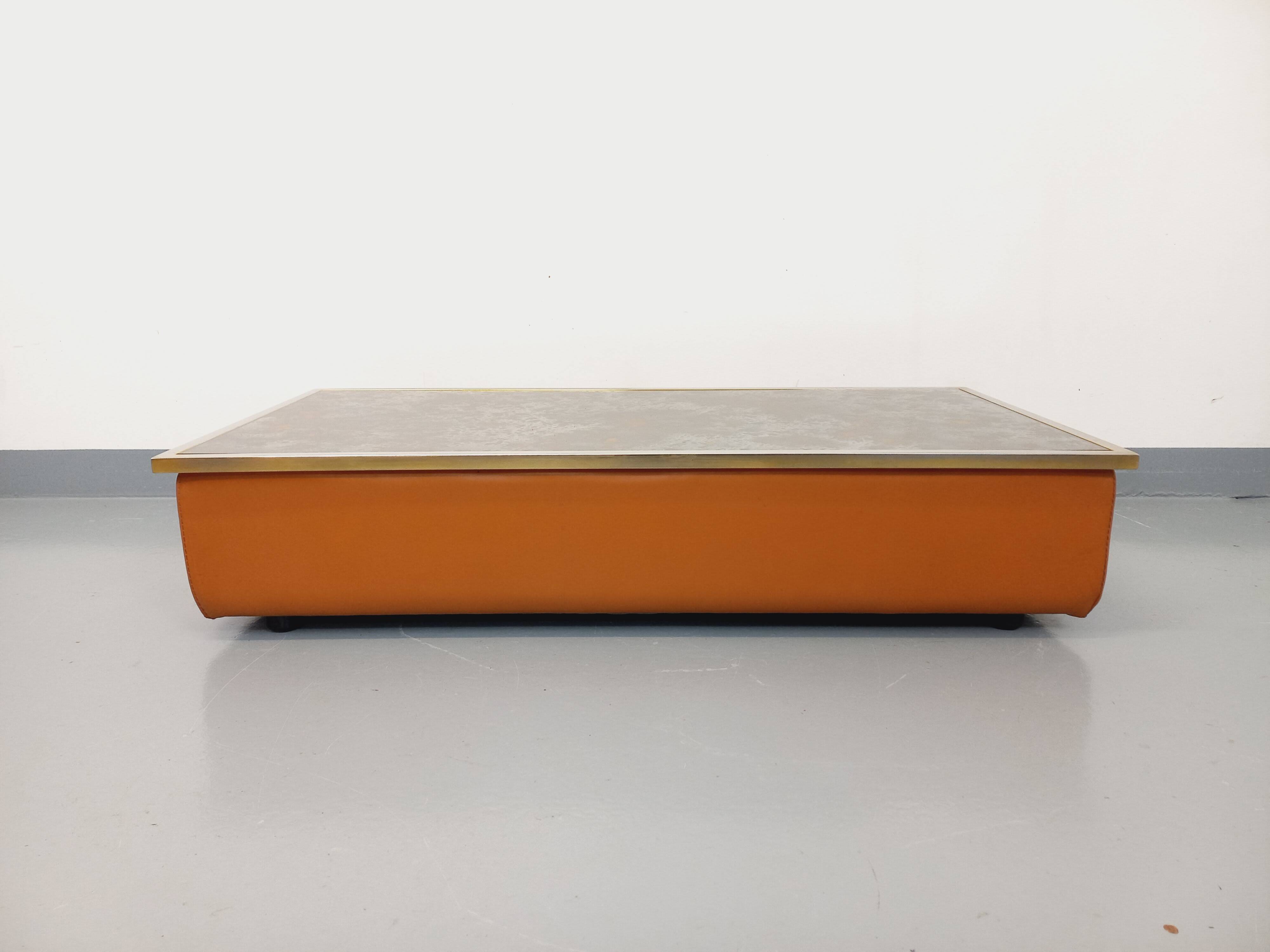 Vintage coffee table in églomisé glass, chrome and leather from the 70s