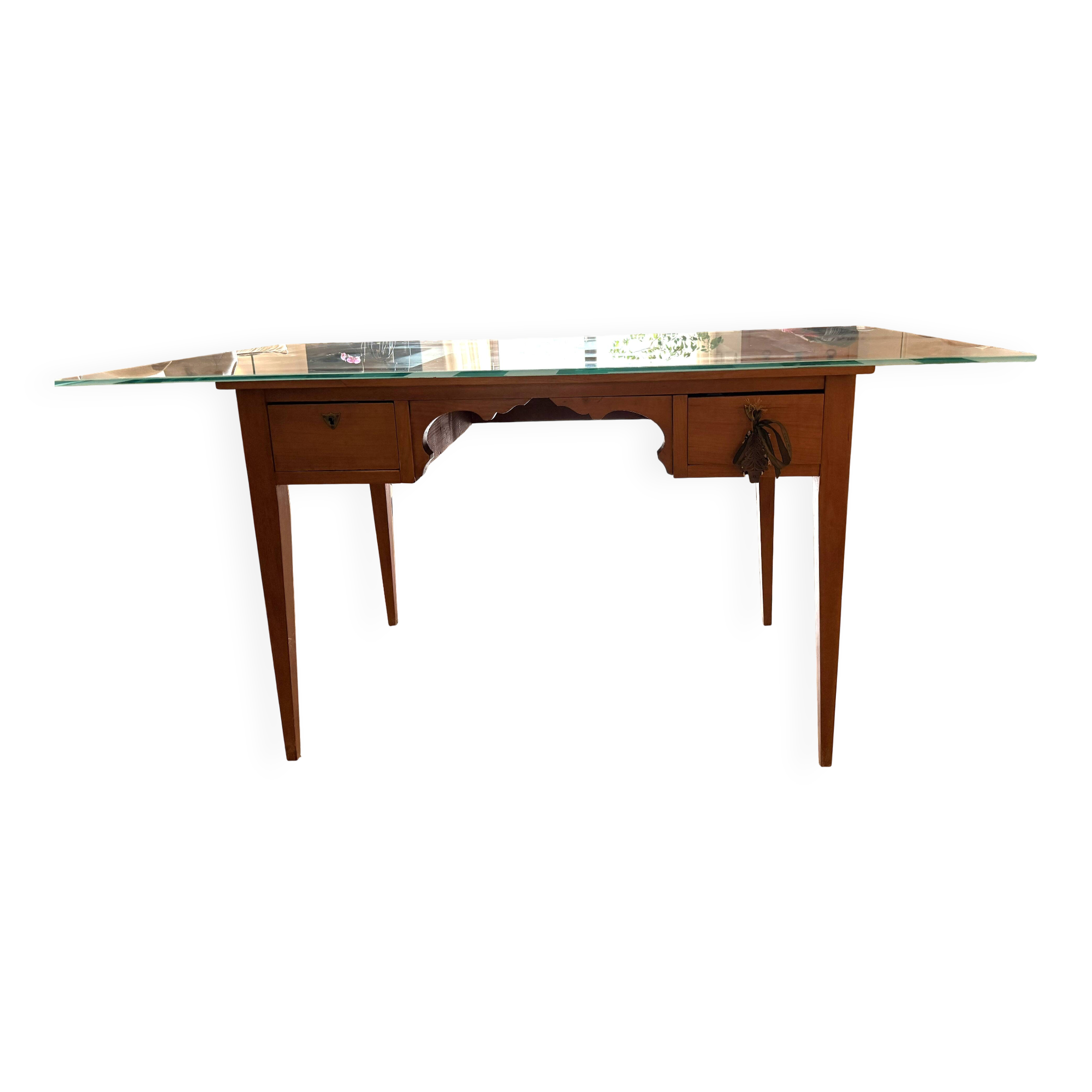 Elegant antique desk in cherry wood with a black leather top and glass plate.