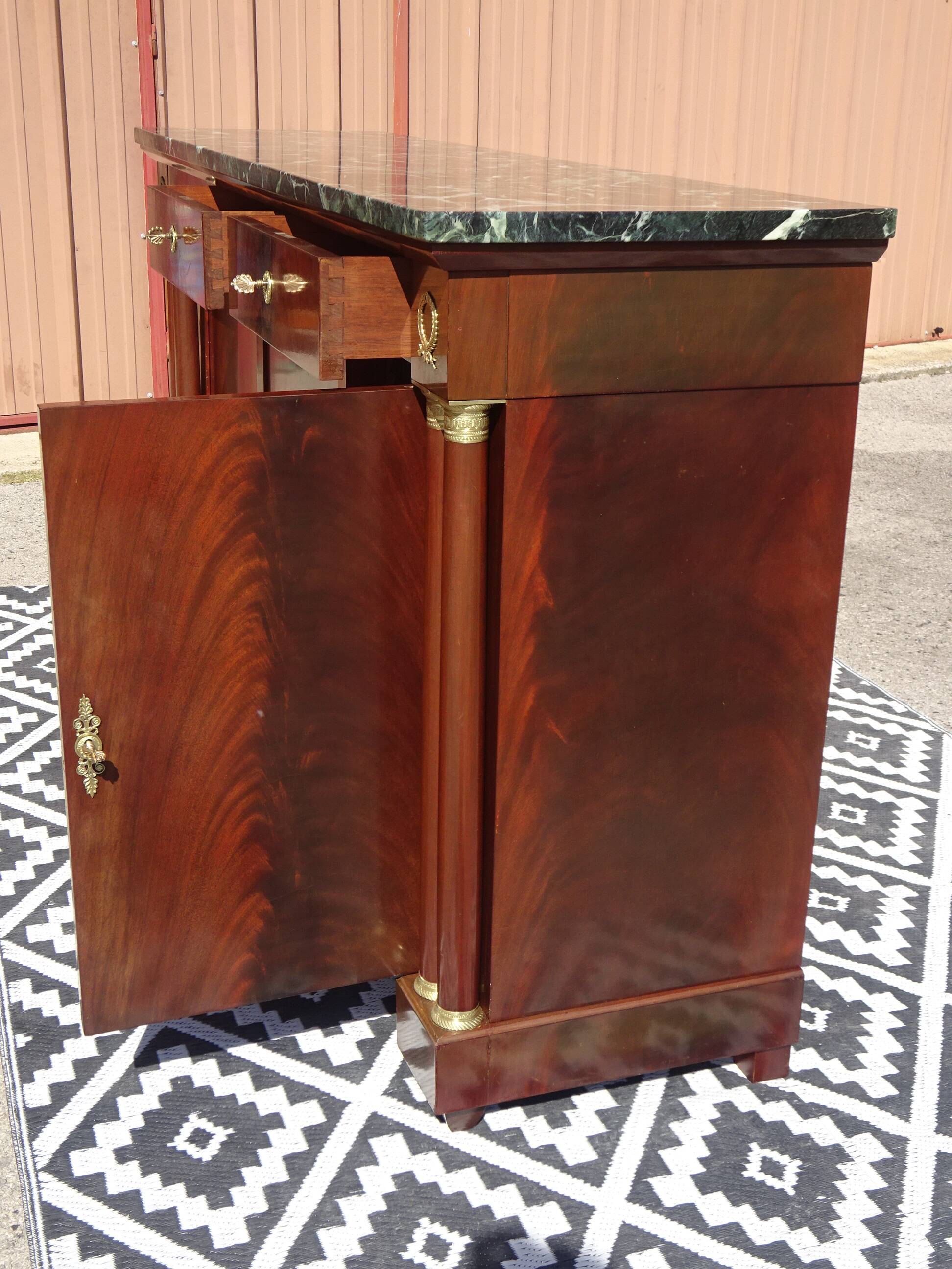 Flamed mahogany enfilade with sea green marble in Empire style.