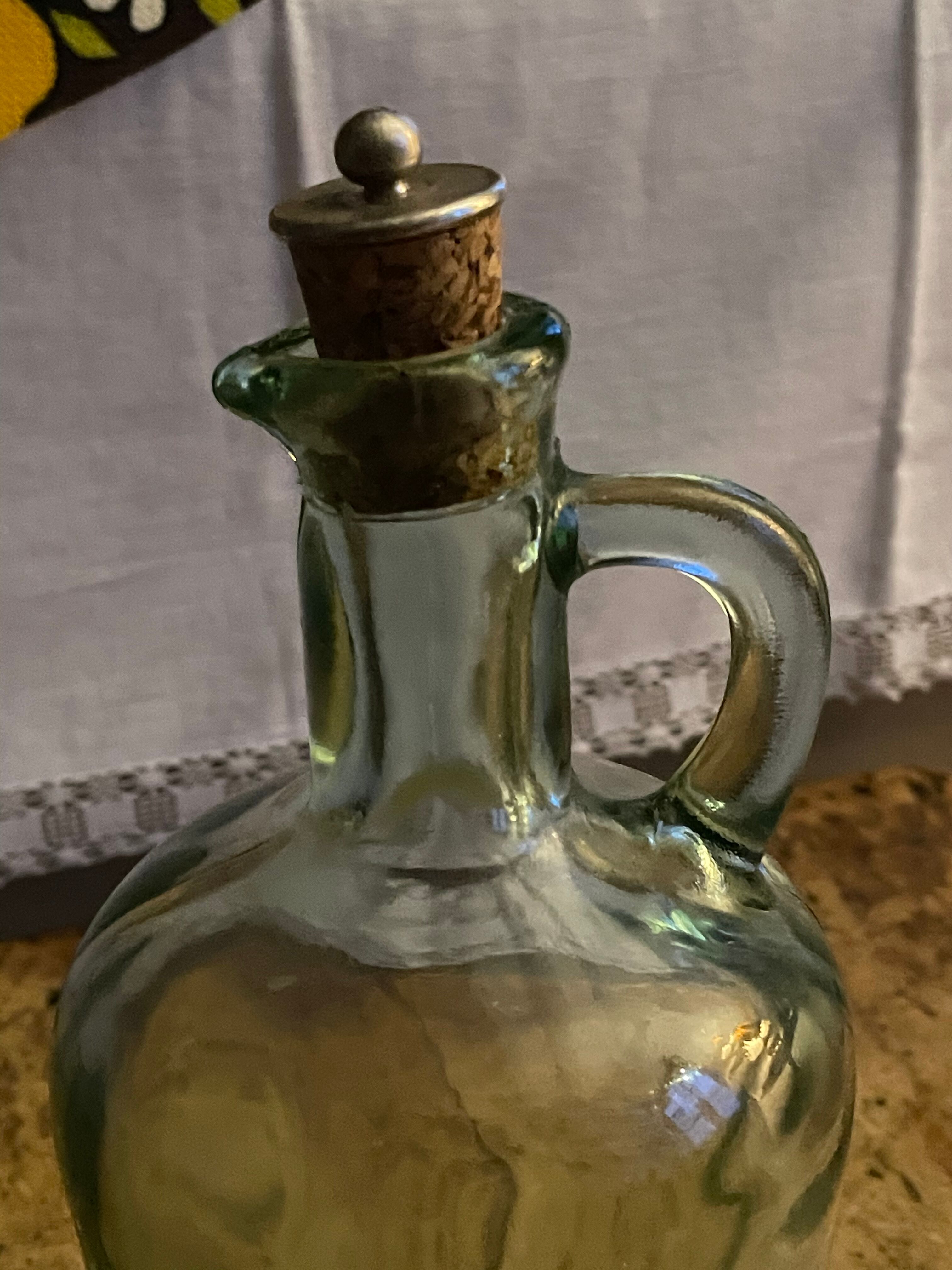 Green pitcher made of vintage glass