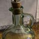 Green pitcher made of vintage glass