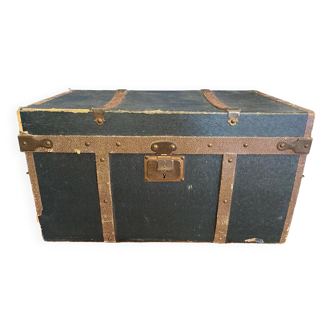 Old travel trunk for cut clothes from the early 20th century with drawers and handles