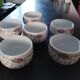 Service of small six cups for tea, cream, fruit salad or coffee