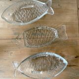 Transparent glass raviers in the shape of a fish