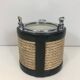 Ice bucket in leather, rope, and chrome. In the style of Jacques Adnet