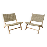 Paire de fauteuils bas en bois et rotin tissé