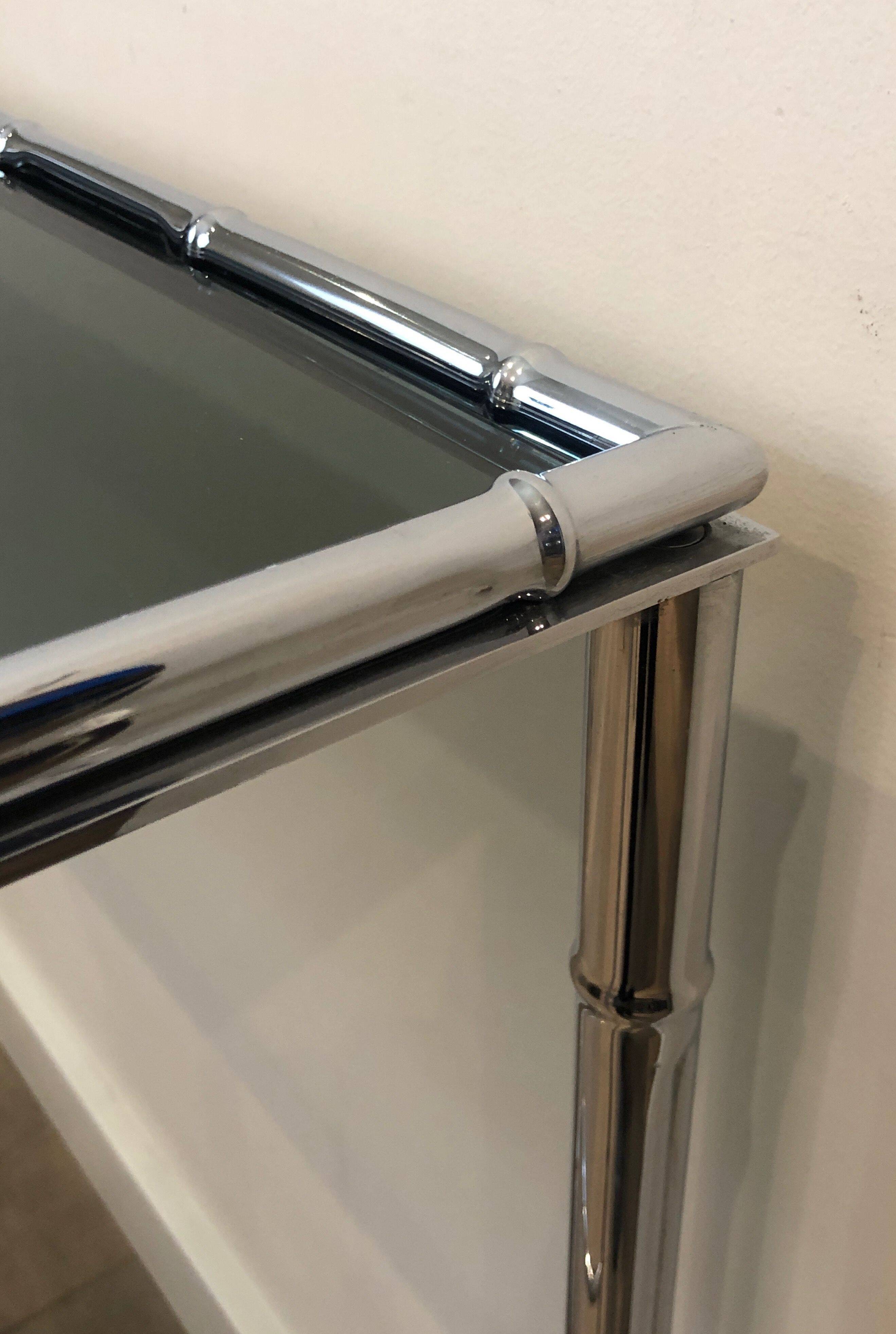 Console and chrome faux-bamboo mirror