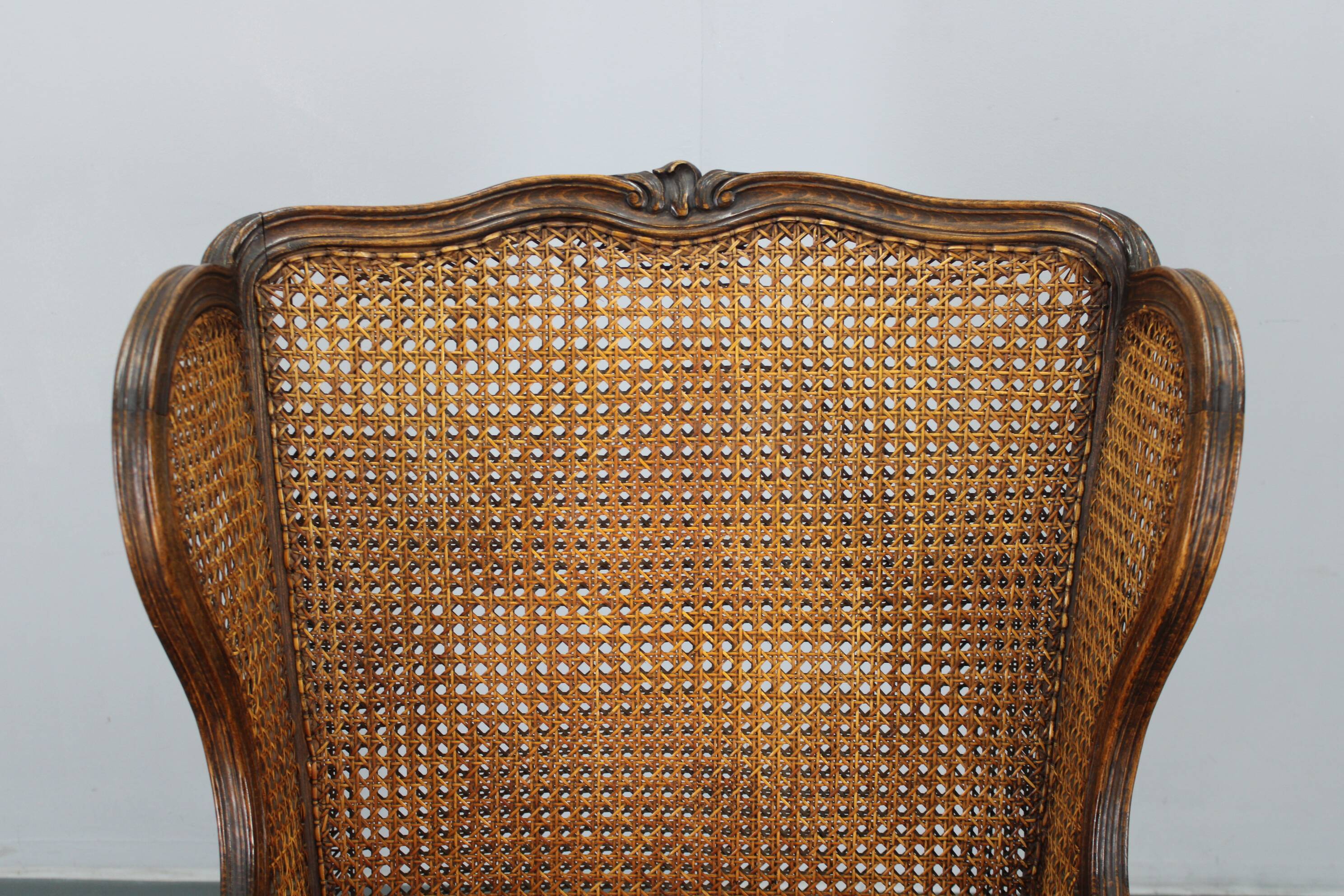 Antique Carved Wing Chair with Cane Sides , Czechoslovakia