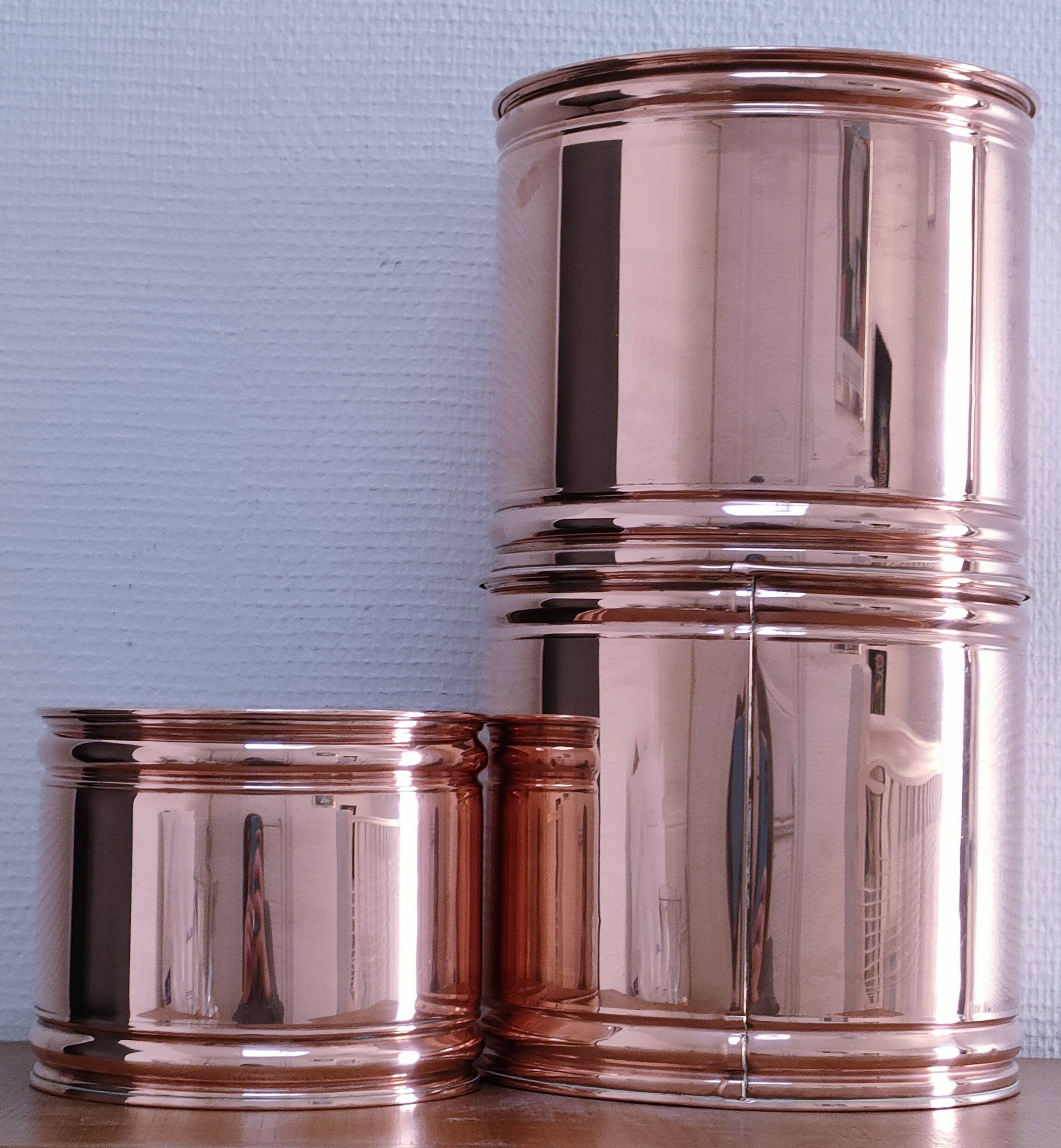 three cylindrical plant pots in a Scandinavian design from the 80s