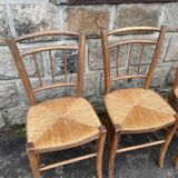four vintage bistro-style straw chairs