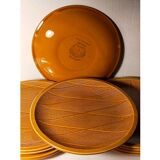 Ten plates in Salins slip with braided patterns 50s