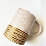 Handmade golden ceramic mug