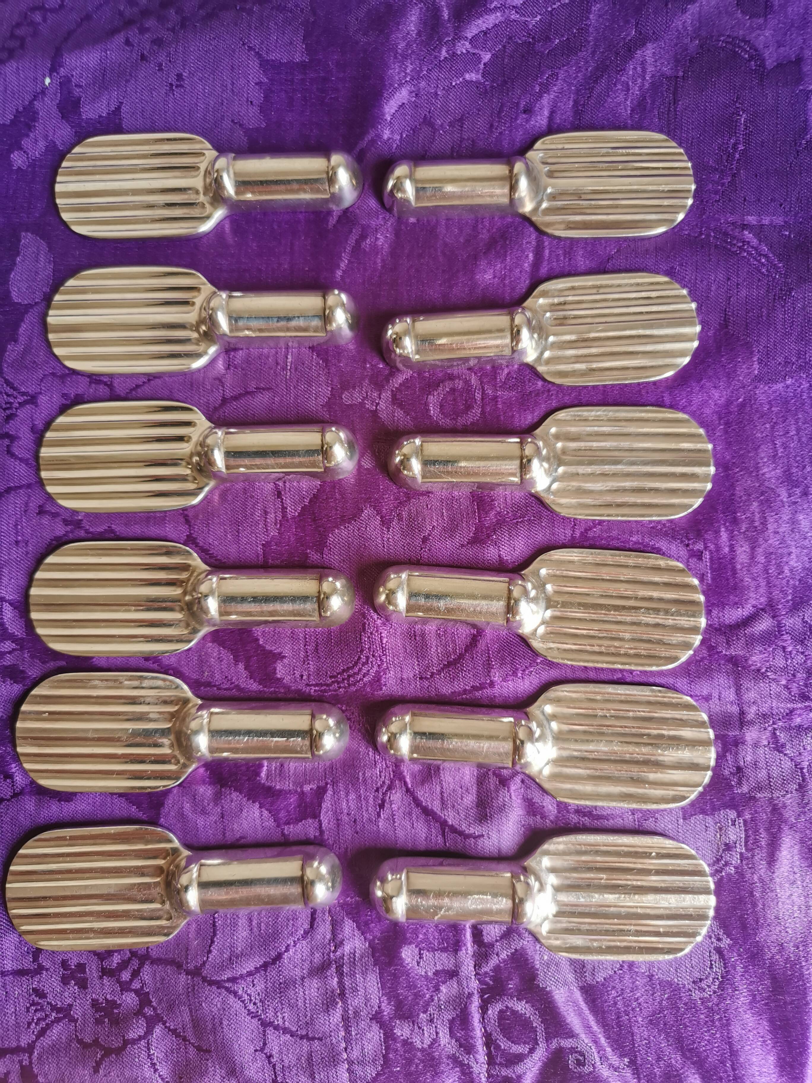 Twelve Christofle knife holders in silver metal