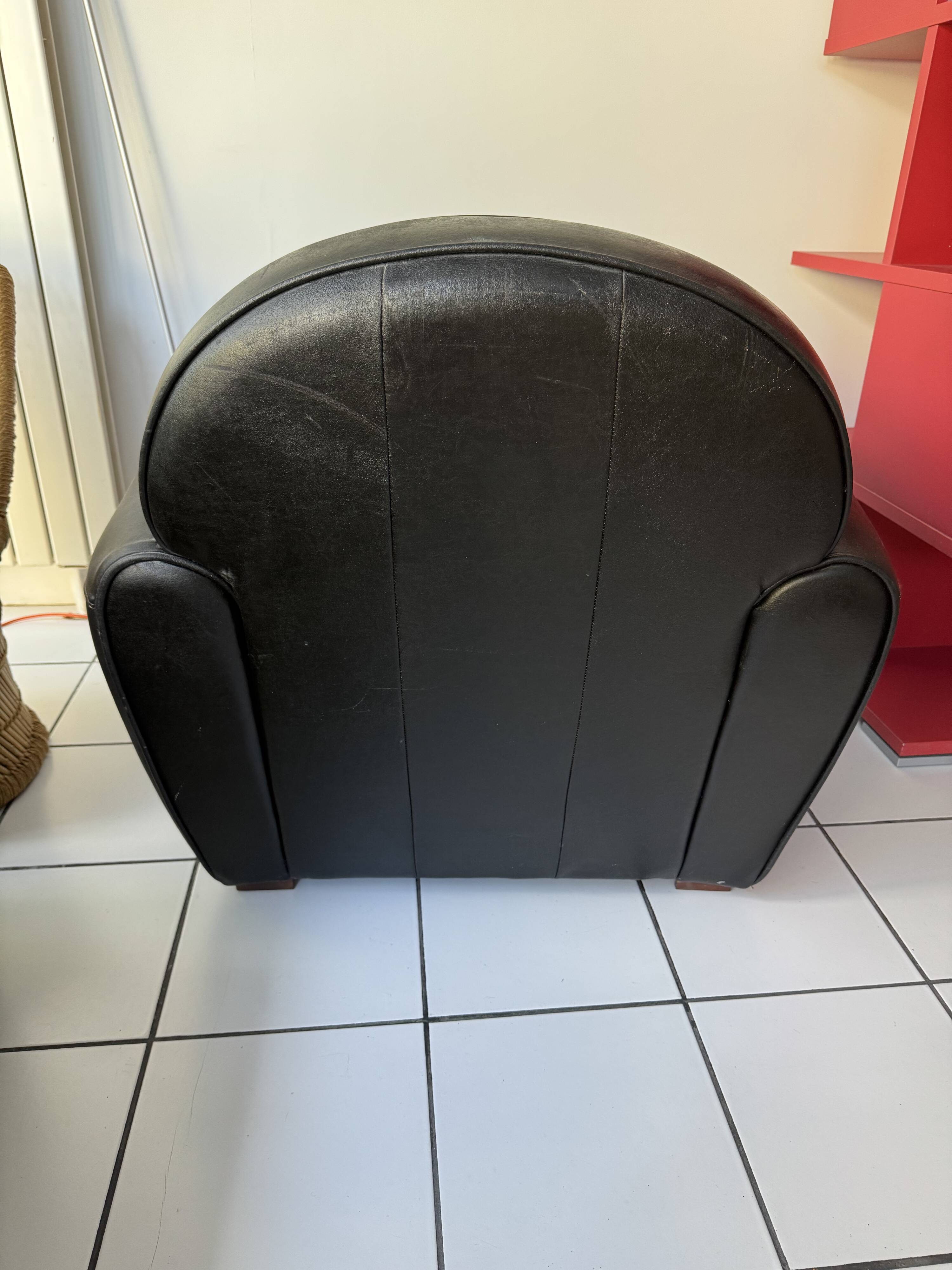 Matching black leather armchair – comfort and elegance