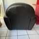 Matching black leather armchair – comfort and elegance