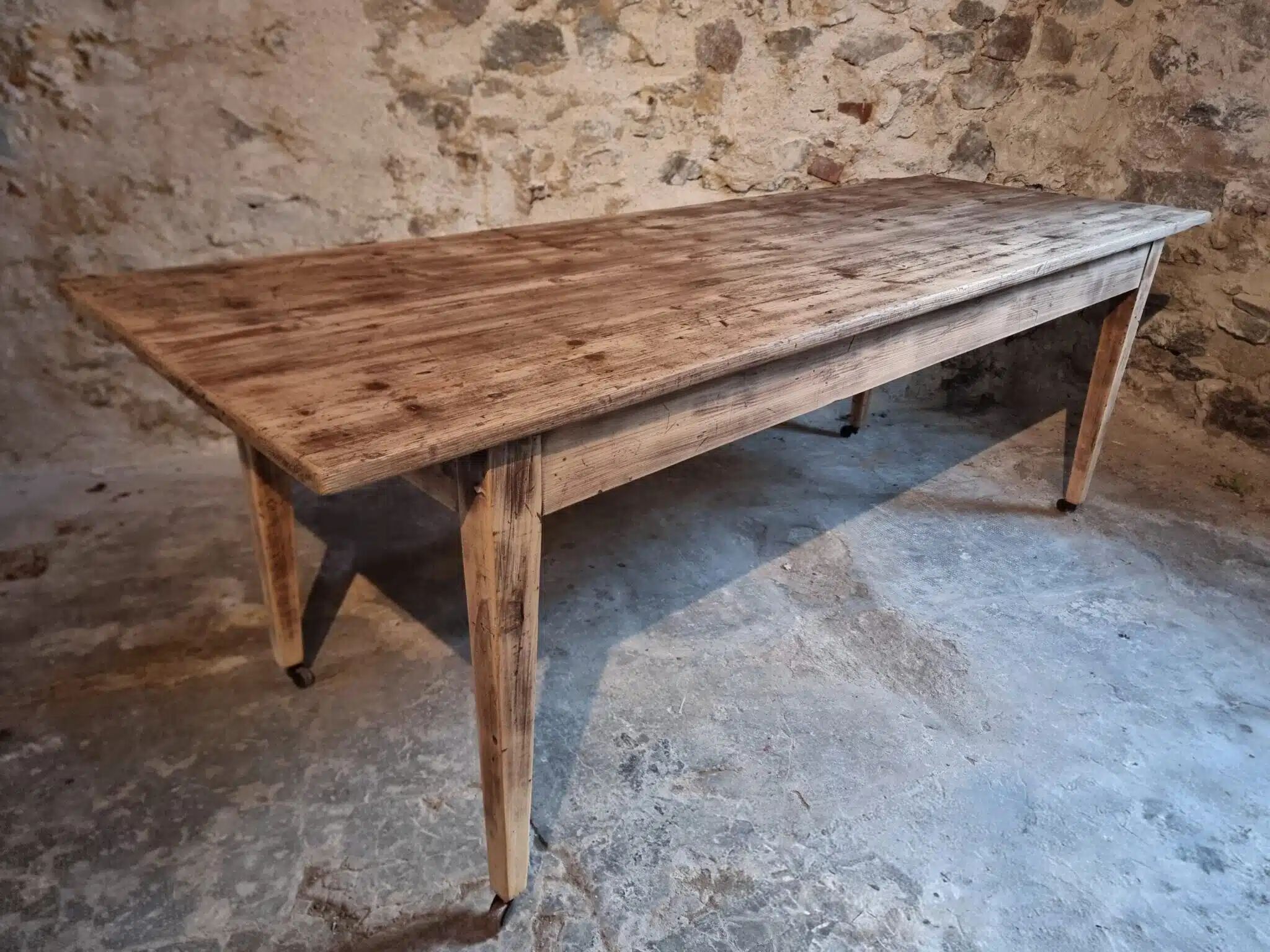 Antique French pine dining table, large farmhouse table on wheels, 19th century.