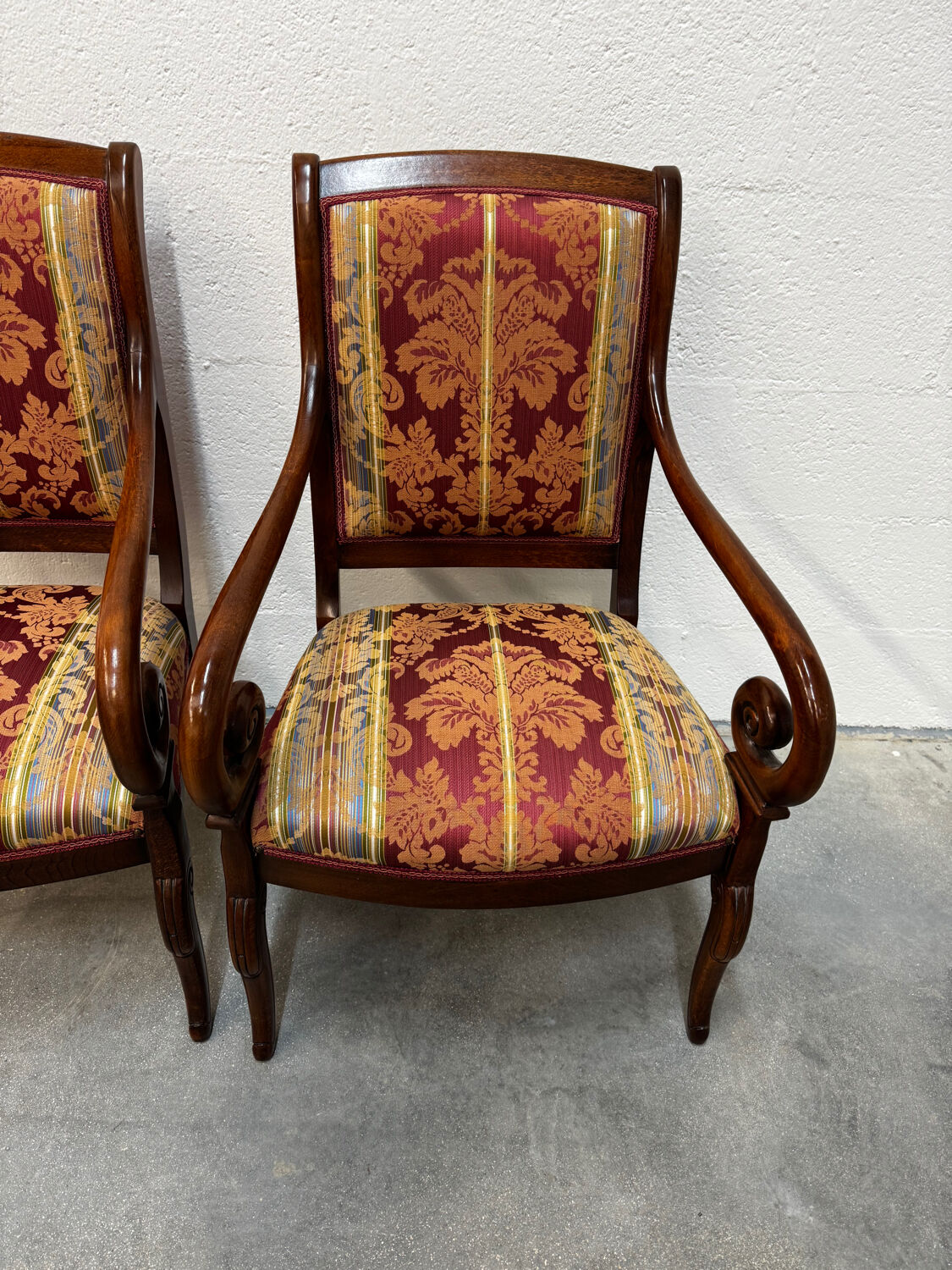 Pair of cross-back armchairs, Empire style, 19th century.