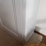 Old white asymmetrical chest of drawers