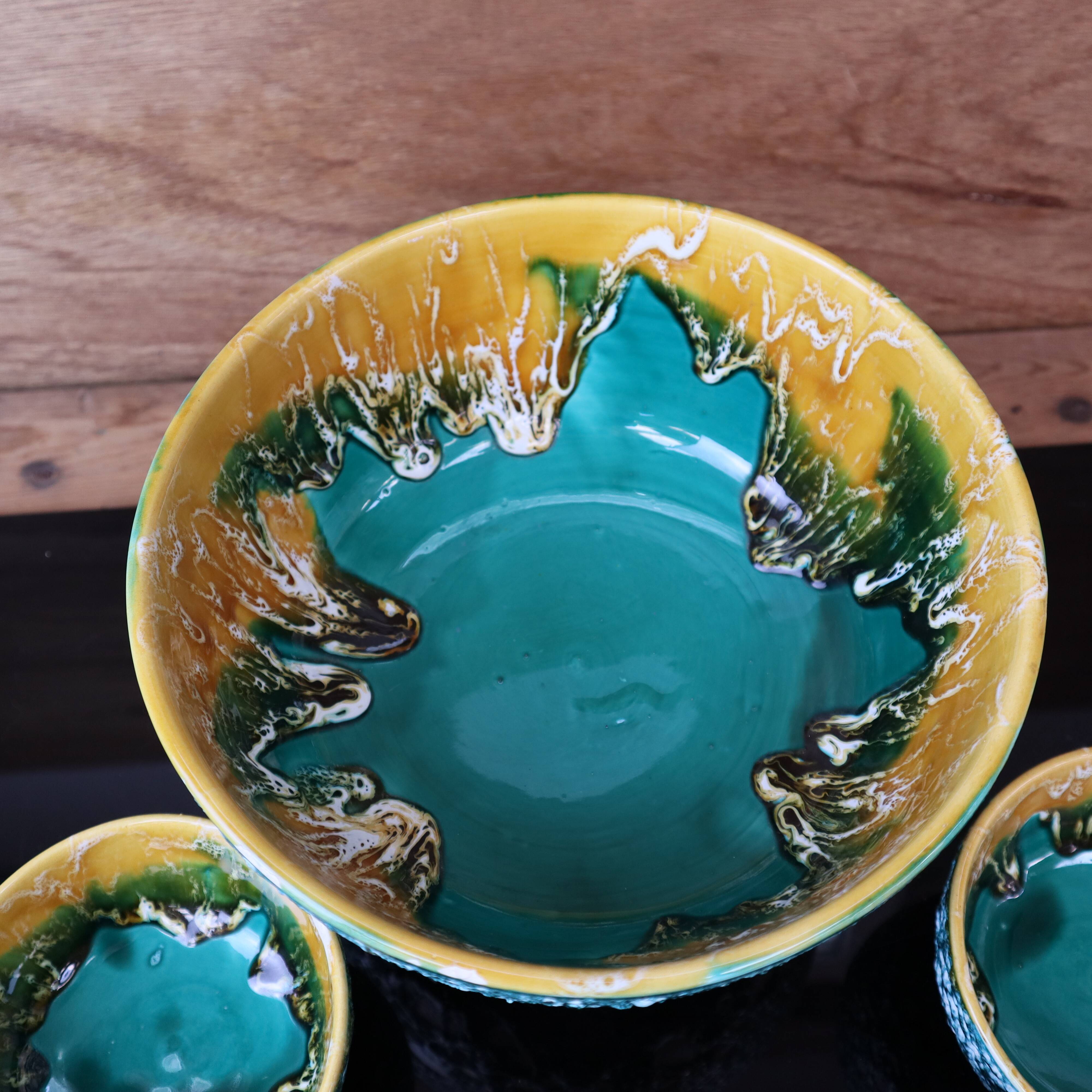 Salad bowl and its 6 Lava Green bowls in Vallauris style.