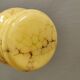 Small Art Deco hanging lamp in cream colored glass with bakelite top. Estimated 1950s