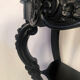 Pair of blackened wooden consoles, marble top