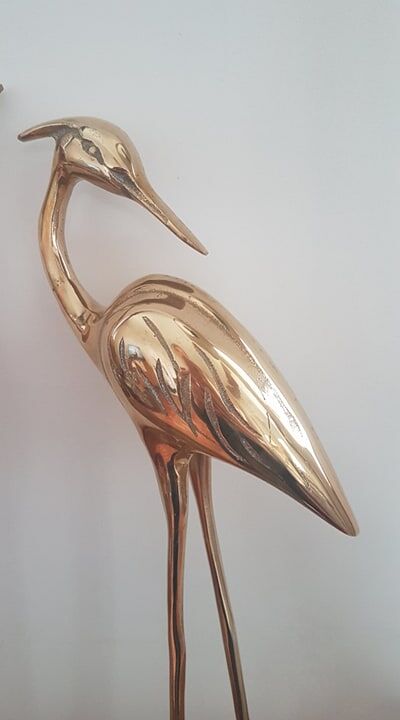 Pair of birds couple of brass herons