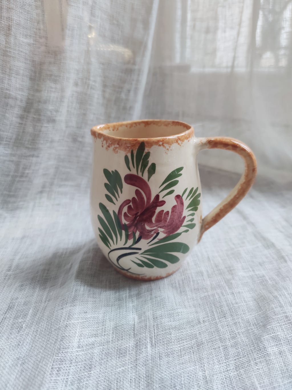 Small hand-painted pitcher