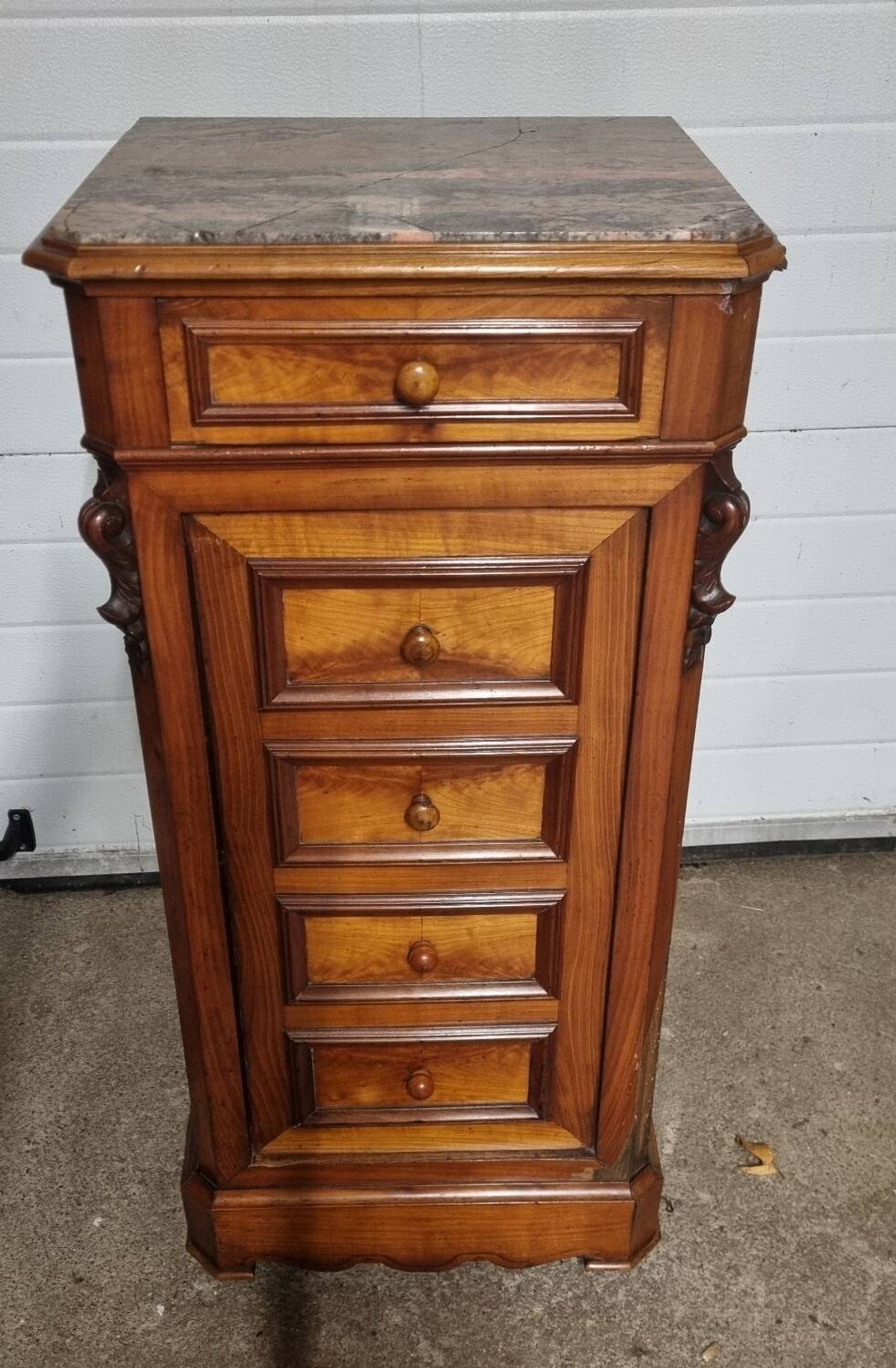 Cherry nightstand with pink marble.