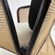 Cubic armchair in black rattan and canework