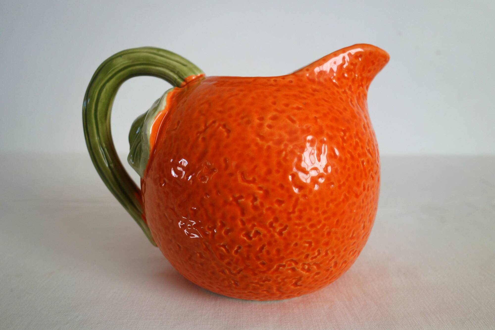 Vintage orange slipware ceramic jug
