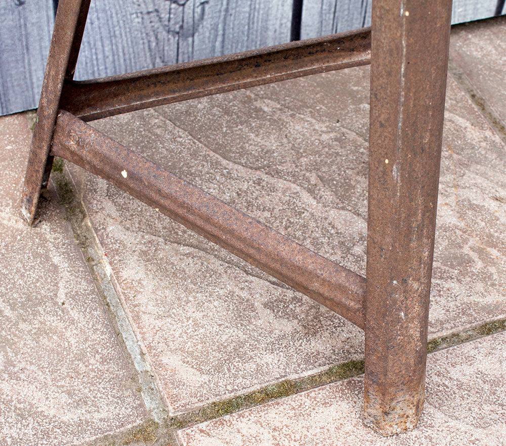 Old industrial stool in metal