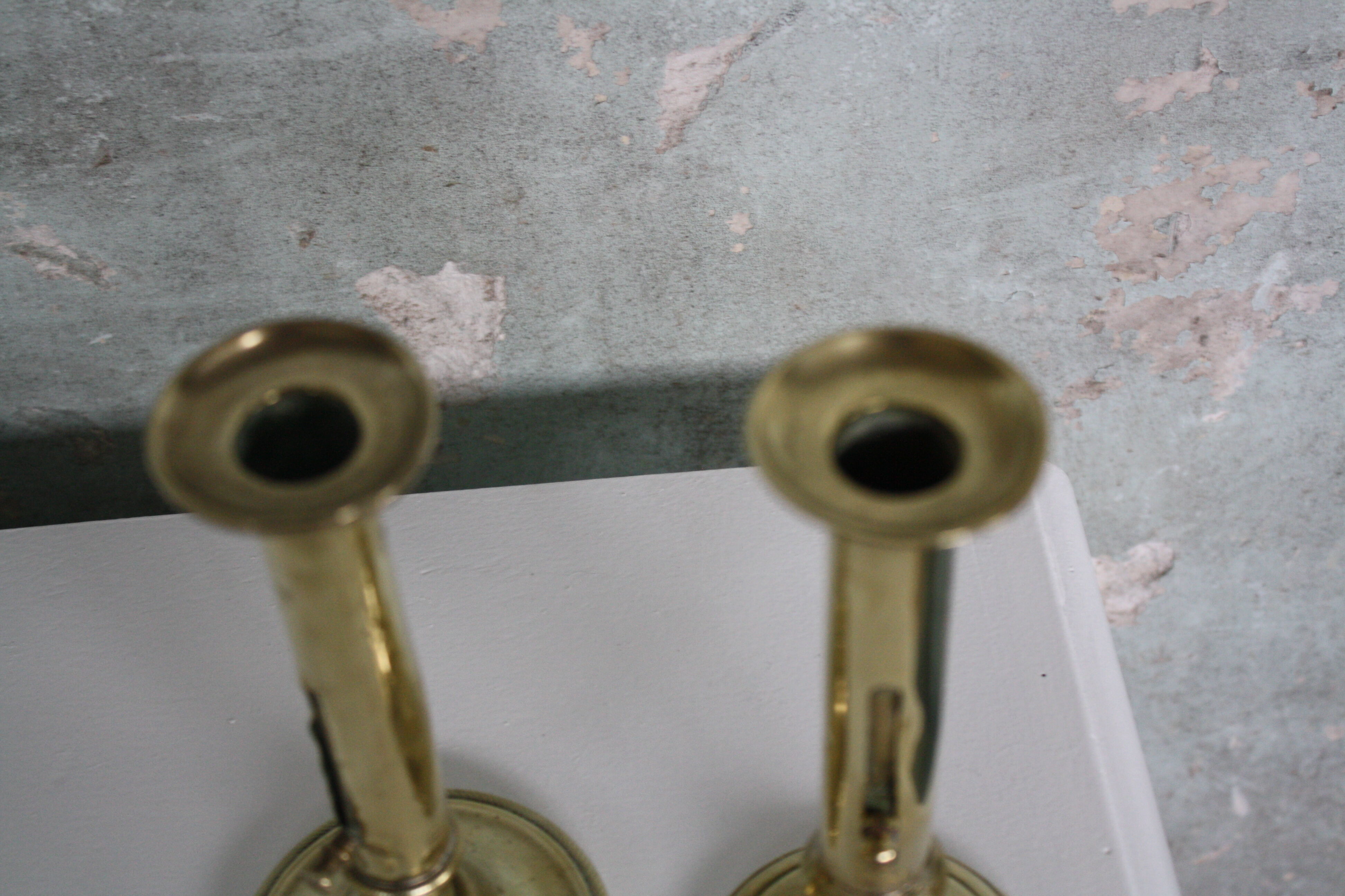 Pair of brass push-up candlesticks