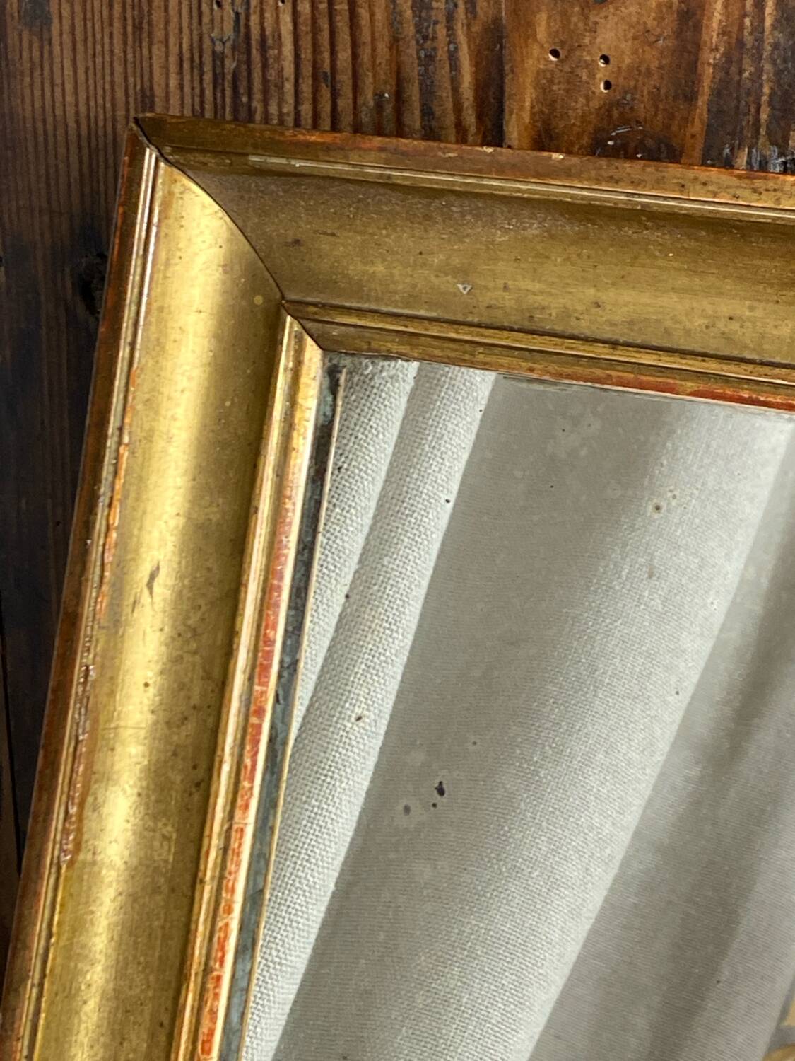 Antique mirror in gilded wood